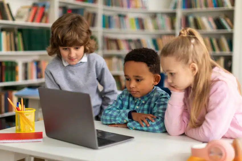 students using laptop for education in the library